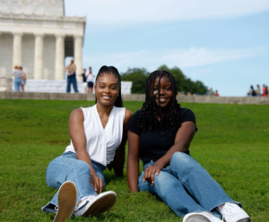 an adult female posing with a young teenager for a photo