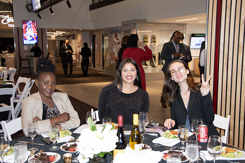 a group photo of young professionals smiling