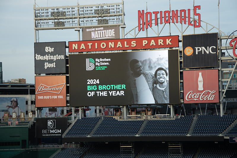 Nationals Park jumbo tron displaying an image of the 2024 Big Brother of the Year