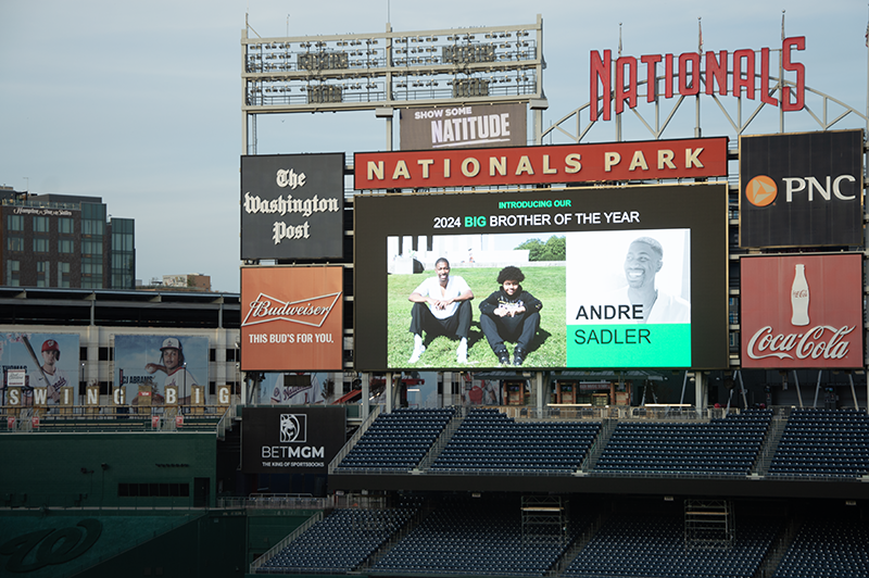 Nationals Park jumbo tron displaying an image of the 2024 Big Brother of the Year