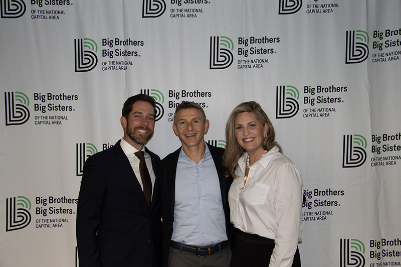 a group photo of young professionals smiling