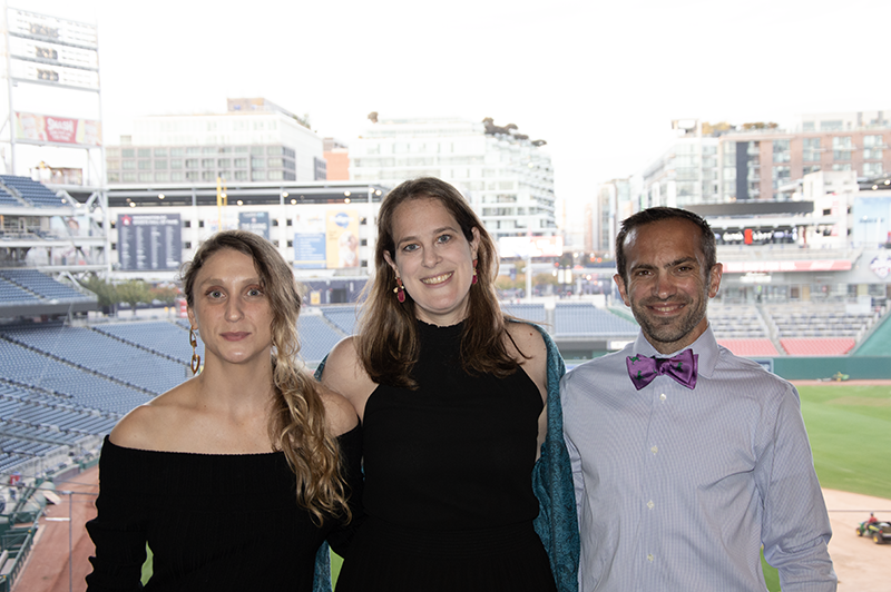 a group photo of young professionals smiling
