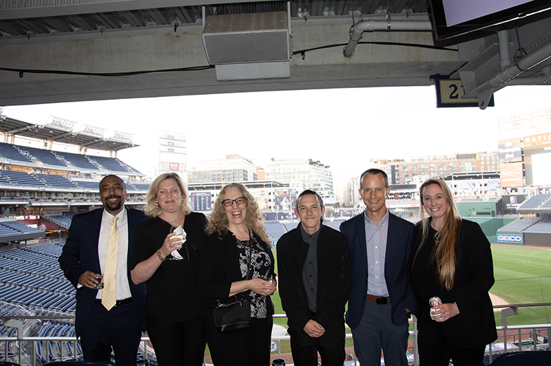 a group photo of young professionals smiling