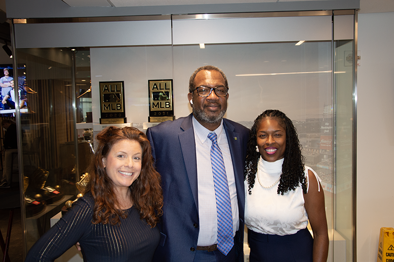 a group photo of young professionals smiling