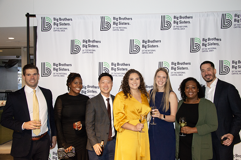 a group photo of young professionals smiling