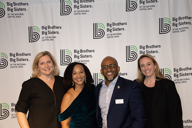 a group photo of young professionals smiling