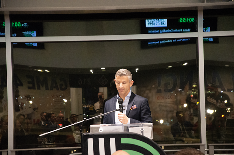 a male professional giving a speech