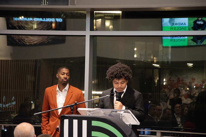 a young male teenager giving a speech