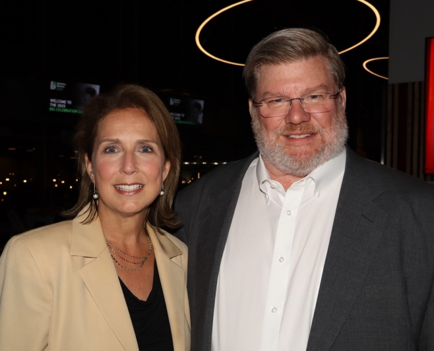 two people smiling for a photo together