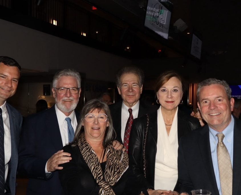 a group photo of people smiling