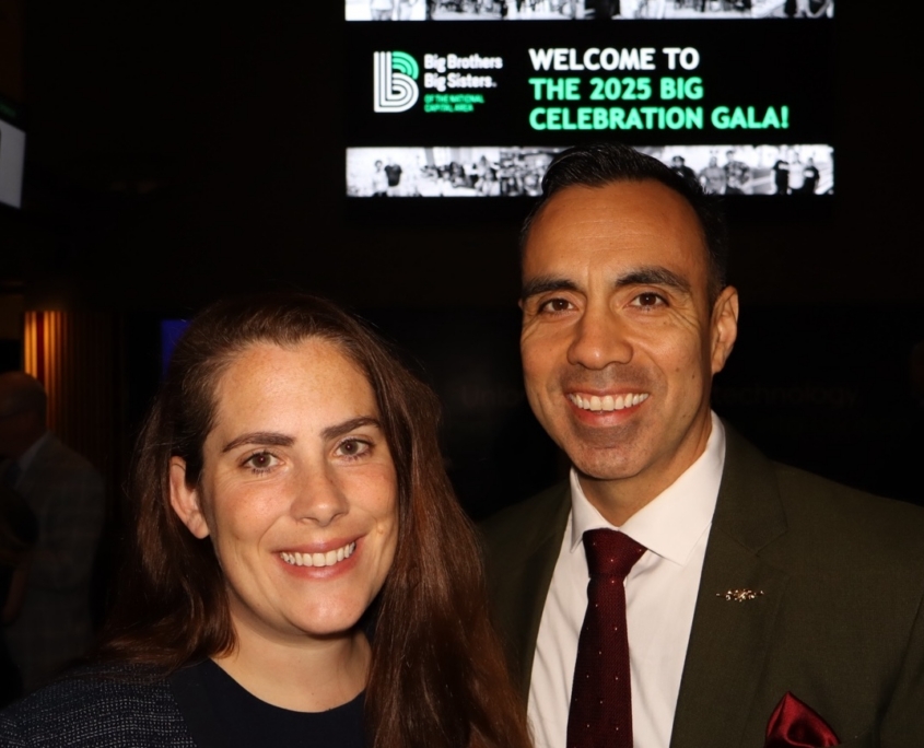 a young adult woman and man smiling