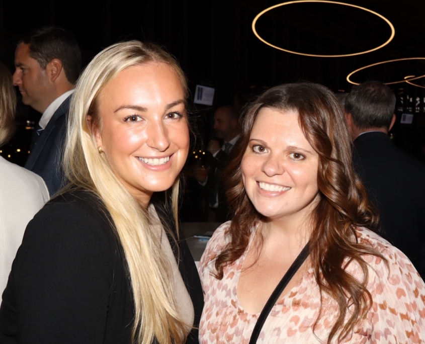 2 young females smiling for a photo