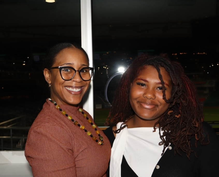 2 young females smiling for a photo