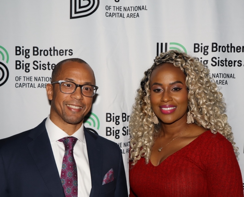 a photo of an adult woman and male smiling