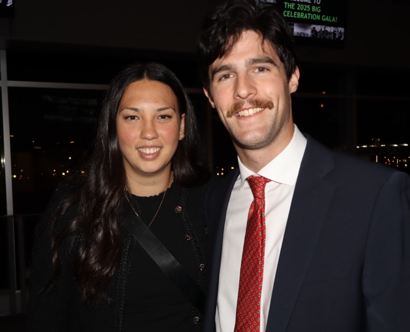 a photo of an adult woman and male smiling