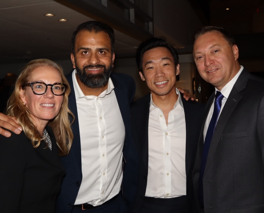 a group photo of adults smiling