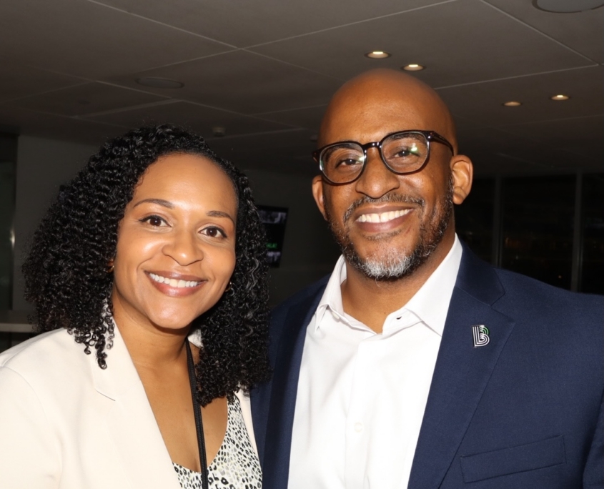 a photo of an adult woman and male smiling